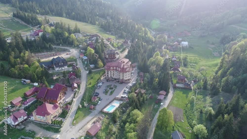Flying over the beautiful Ukrainian Carpathians mountain and coniferous forest overlooking the beautiful lush green valley and the village. Aerial camera shot. Landscape panorama. Ukraine. Video 4k Flying over the beautiful Ukrainian Carpathians mountain and coniferous forest overlooking the beautiful lush green valley and the village. Aerial camera shot. Landscape panorama. Ukraine. Video 4k