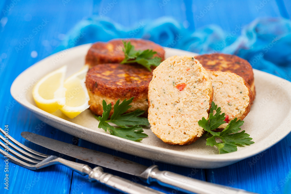 fish balls with lemon on dish on wooden background fish balls with lemon on dish on wooden background