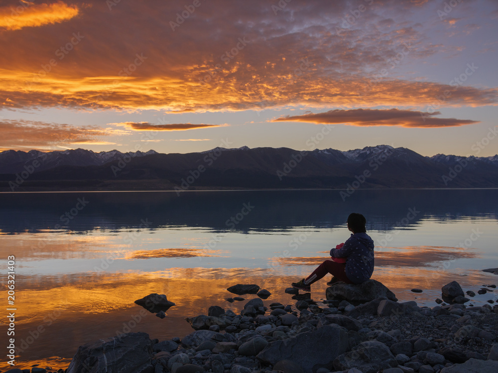 dreamer, silhouette of woman sitting along the lake at sunset, human strength, psychology concept dreamer, silhouette of woman sitting along the lake at sunset, human strength, psychology concept