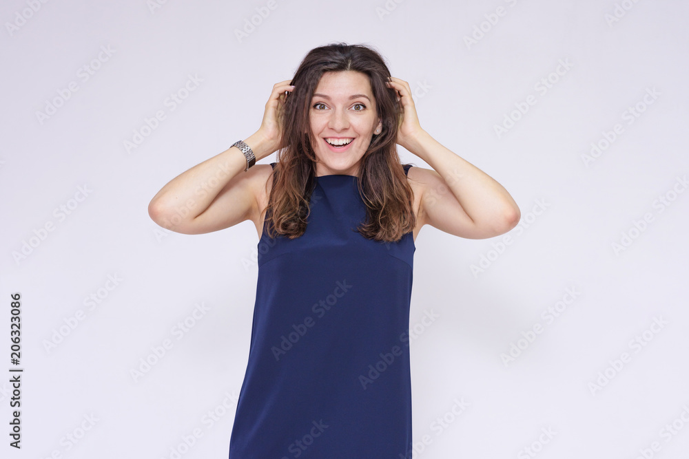 portrait of a beautiful brunette girl in a dress on a white background in different poses portrait of a beautiful brunette girl in a dress on a white background in different poses