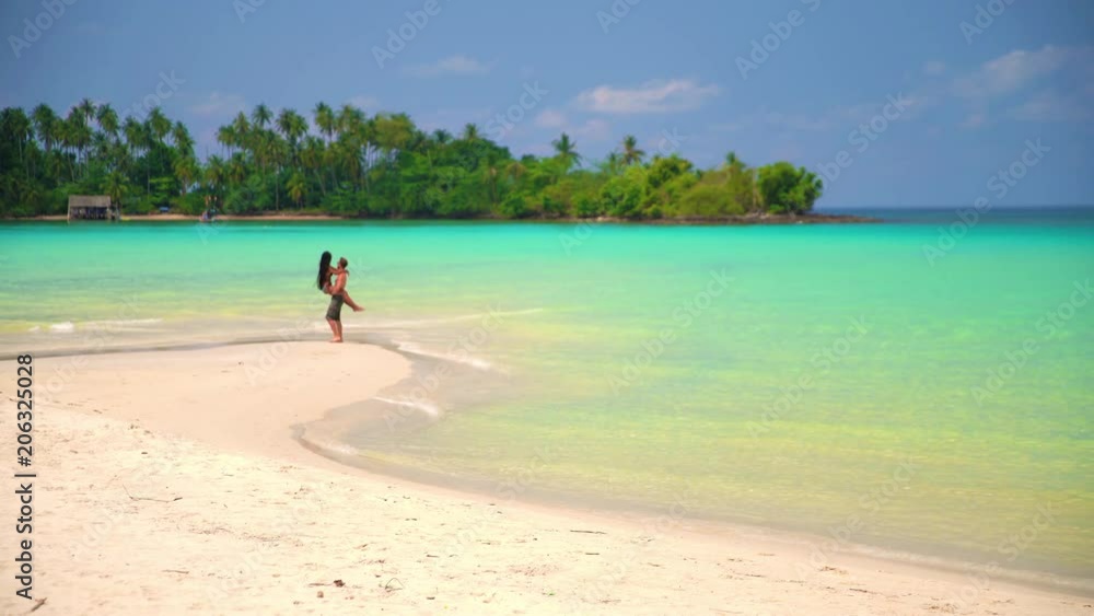 silhouetted loving couple kissing on the beach on background beautiful tropical nature silhouetted loving couple kissing on the beach on background beautiful tropical nature