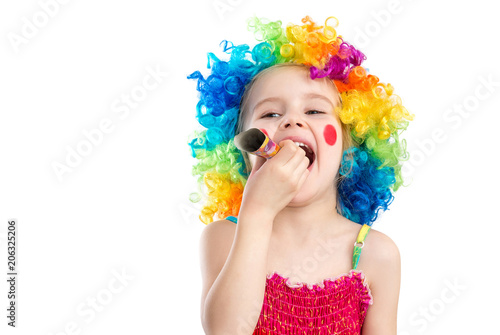 Profile view of little girl in clown wig
