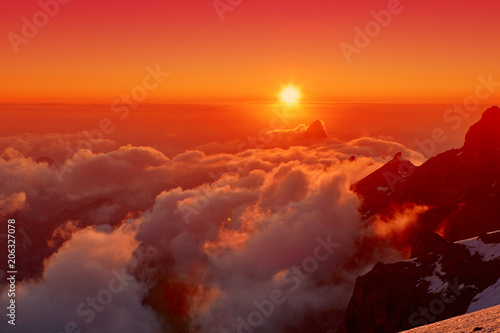 Beautiful sunset on the mountains above clouds, pass Mirali, 5300, Fann, Pamir Alay, Tajikistan