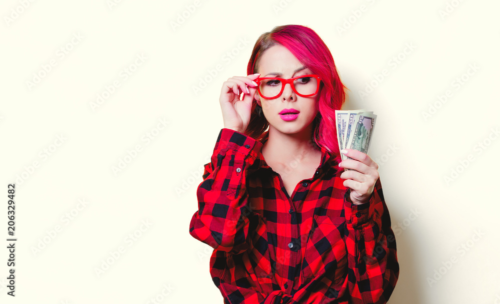 Young pink hair girl in red tartan shirt with money. Young pink hair girl in red tartan shirt with money.