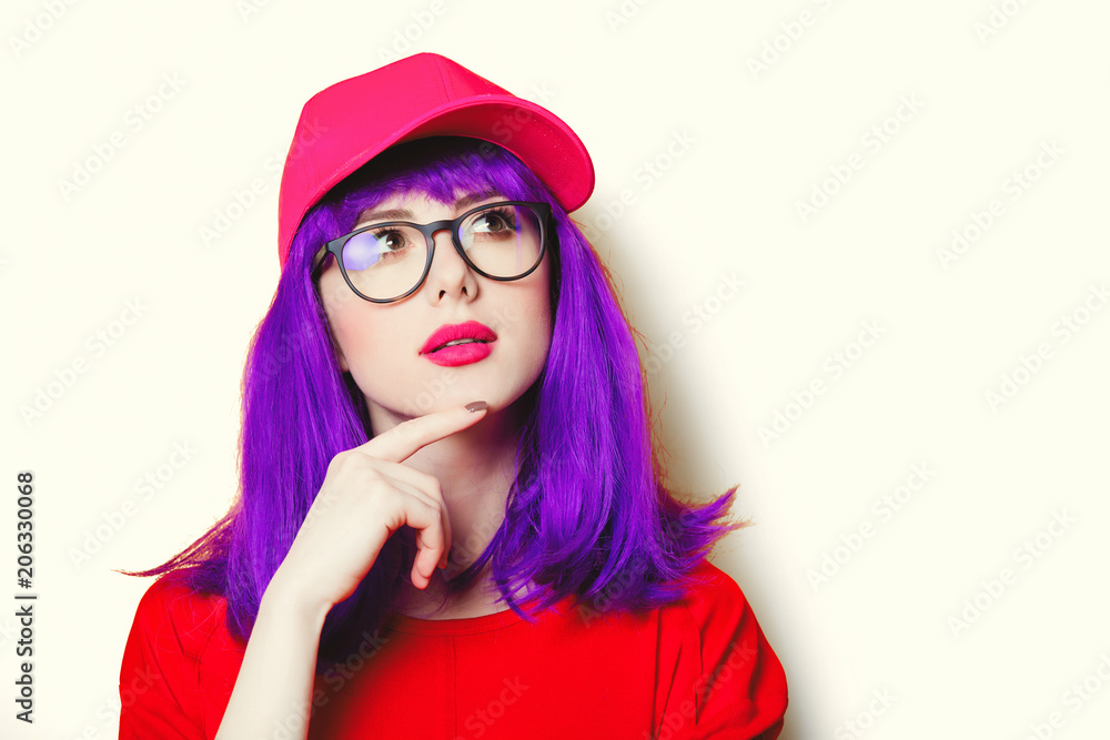 portrait of beautiful young woman in cap and glasses portrait of beautiful young woman in cap and glasses