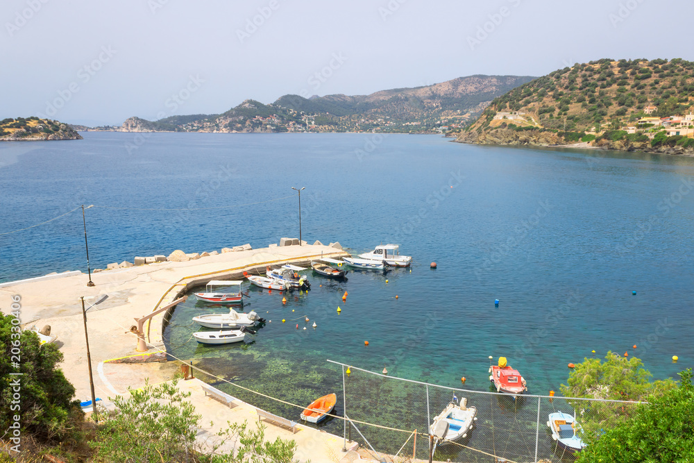 Small pier with boats. The island of Salamina.Greece. Concept- vacation, tourism, travel.