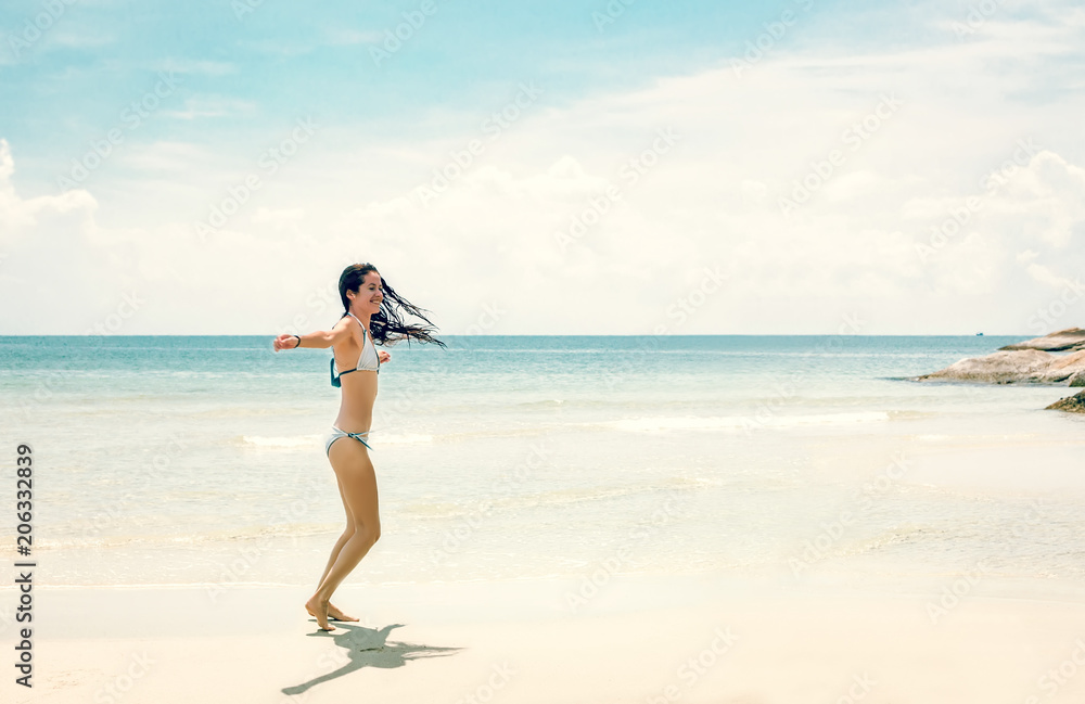 Young slim woman dancing on tropical beach Young slim woman dancing on tropical beach
