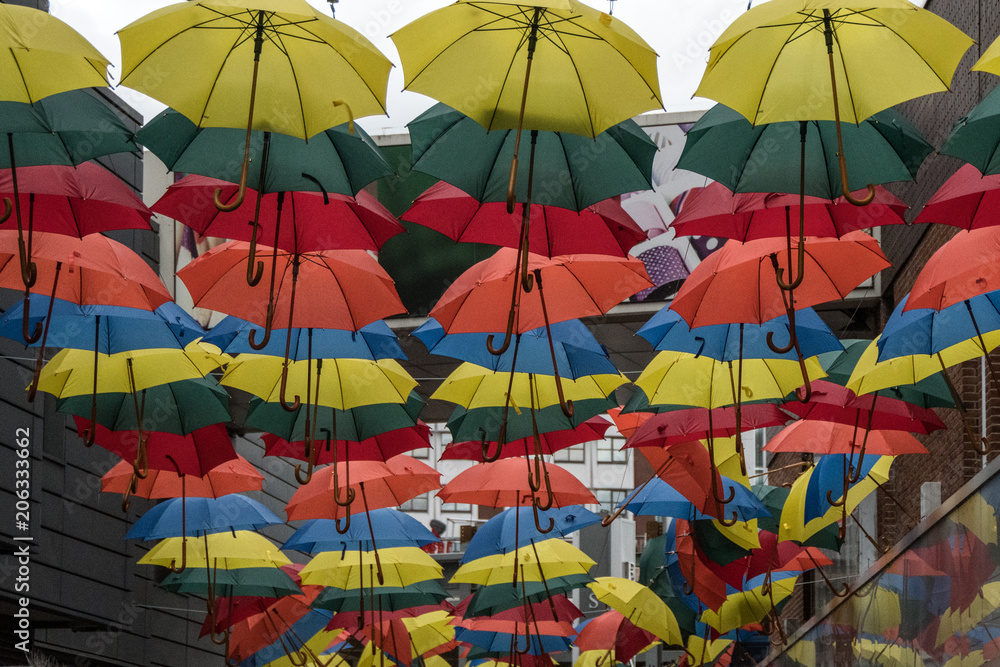 Coloured umbrellas hanging in the shopping centre of Kingston upon Thames
