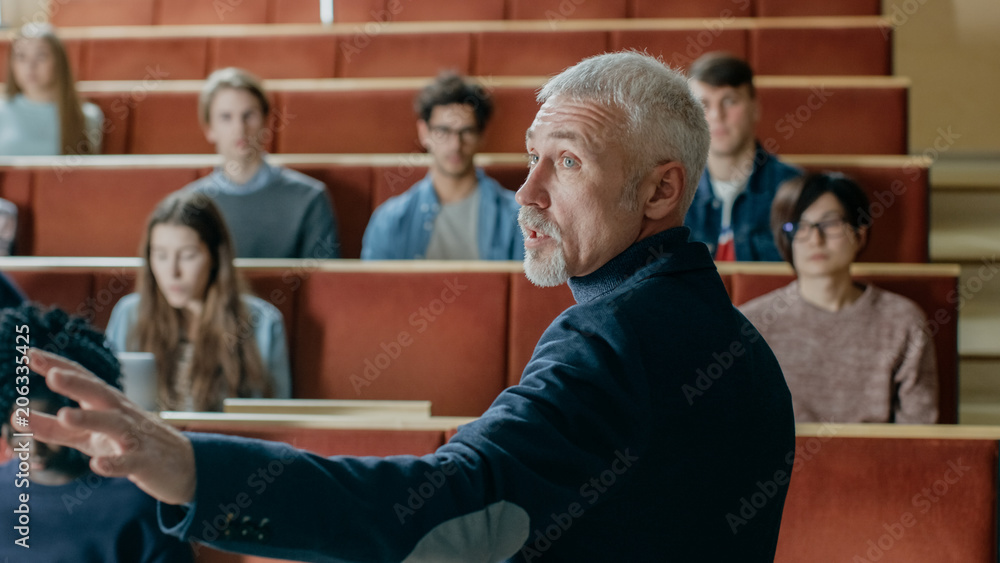 Camera Facing Class: College Professor Gives a Lecture to a Classroom ...