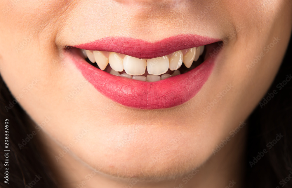 Macro - Close up lips of happy young woman Macro - Close up lips of happy young woman