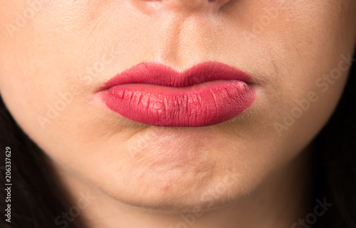 Macro - Close up lips of sad young woman
