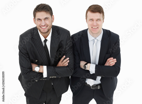 in full growth.two serious business partners standing,isolated on white background.