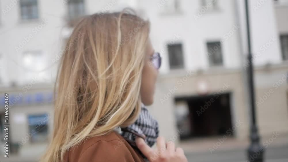 A young girl walking around the city A young girl walking around the city