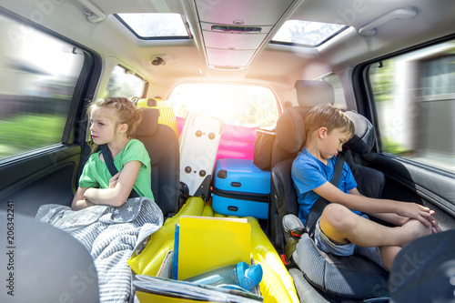 Siblings arguing in the car during a long car journey