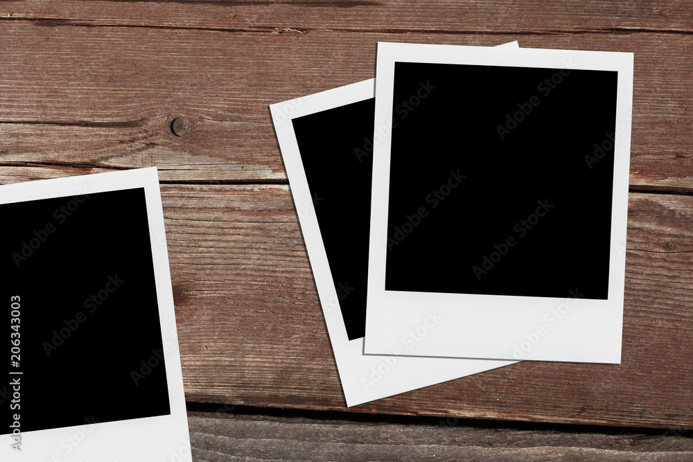 Retro realistic blank instant photo on wooden background. Retro realistic blank instant photo on wooden background.
