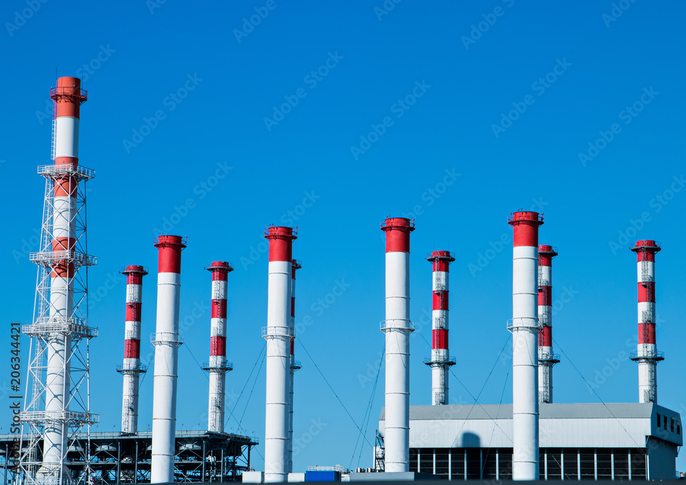 Obraz premium industrial enterprise against a blue sky