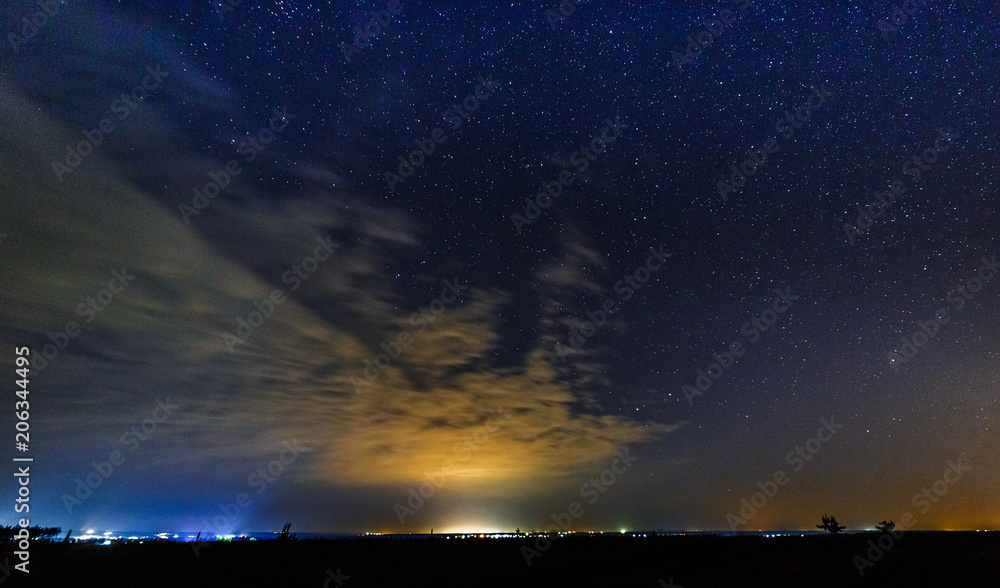 Starry sky and illuminated clouds. Starry sky and illuminated clouds.