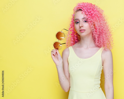 Wallpaper Mural Portrait. A beautiful girl in sunglasses with an incredible curly pink hairdo in a summer dress. Torontodigital.ca
