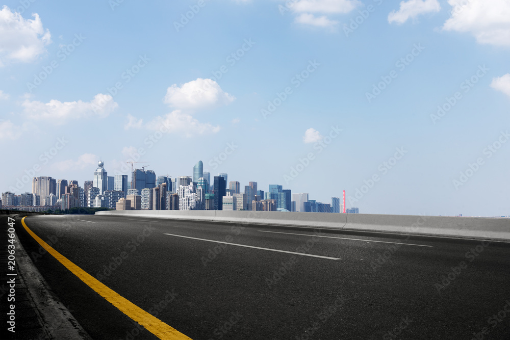 cityscape of modern city from empty asphalt road