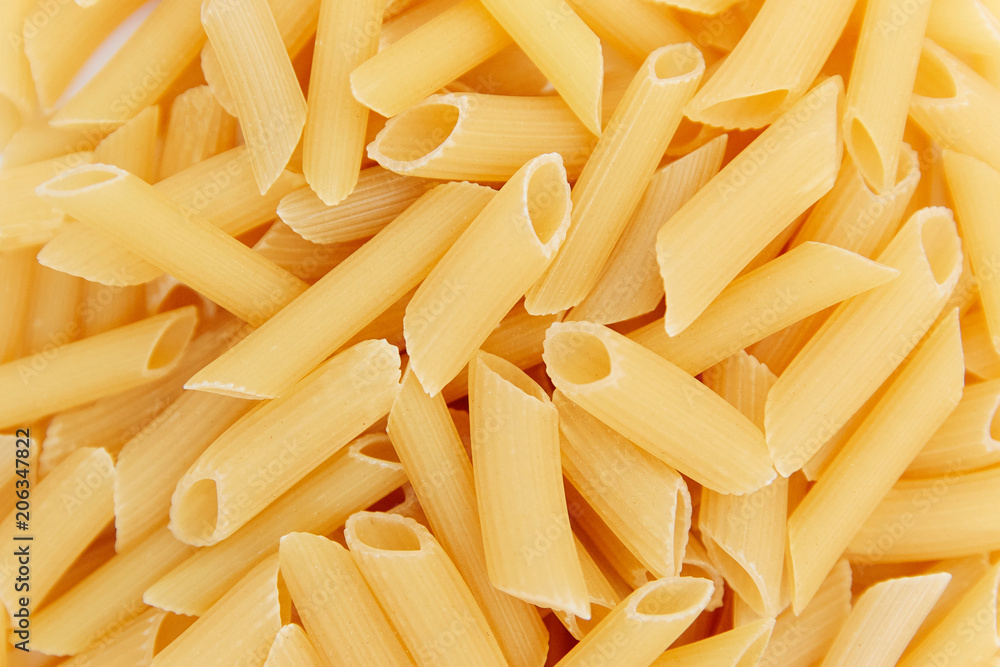 heap of raw pasta. top view. background. close up. italian food or cuisine heap of raw pasta. top view. background. close up. italian food or cuisine