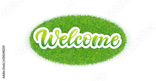 Lettering Welcome on the grass.