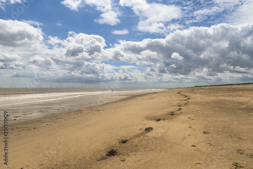 Sandy beach with footprints 