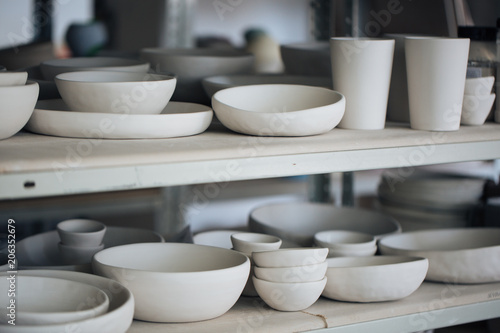 Handcrafted on a potter's wheel,Hands make clay from various items for home and sale in the store and at the exhibition, ceramic items are made in hand, the clay billet becomes a ceramic dish