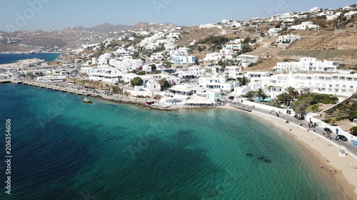 Aerial drone, bird's eye view photo of iconic and traditional whitewashed old port of Mykonos island, Cyclades, Greece