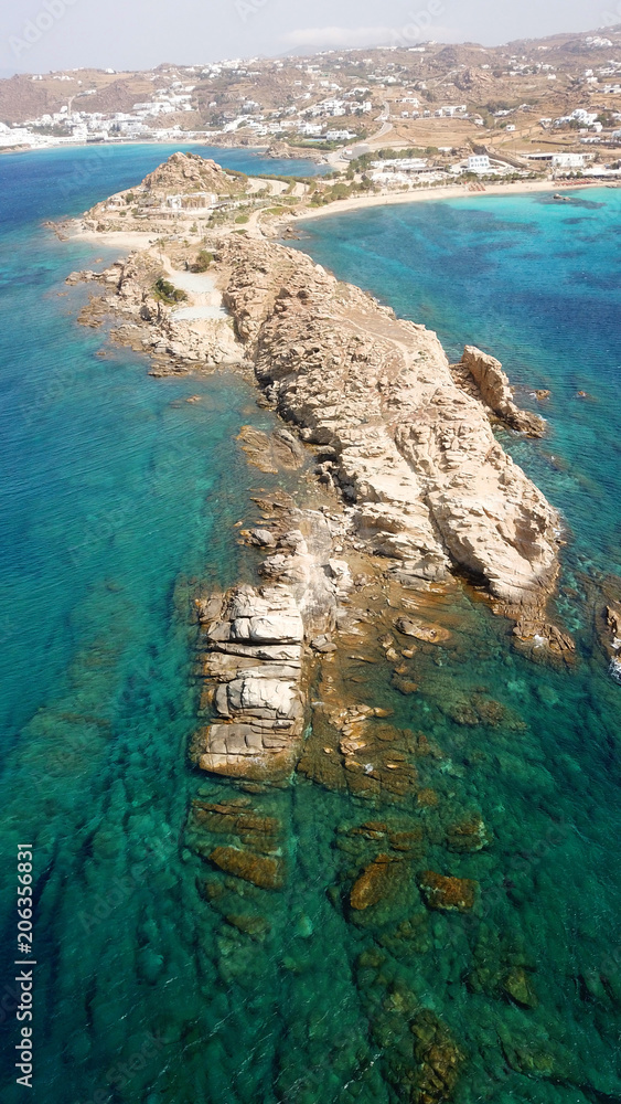 Aerial drone bird's eye view of famous Paraga beach featuring iconic beach bar of Skorpios and Santa Anna, Mykonos island, Cyclades, Greece