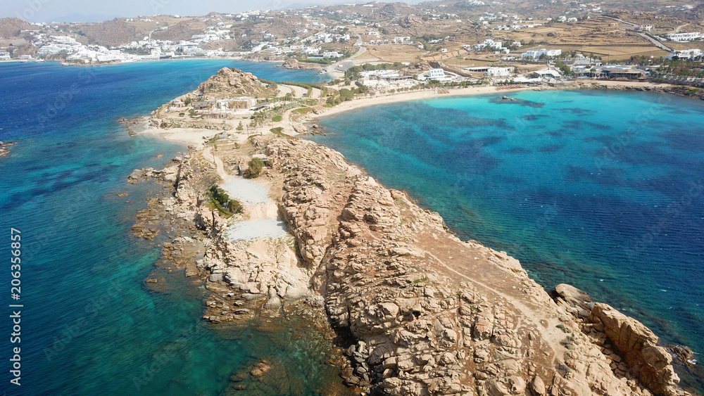 Aerial drone bird's eye view of famous Paraga beach featuring iconic beach bar of Skorpios and Santa Anna, Mykonos island, Cyclades, Greece Aerial drone bird's eye view of famous Paraga beach featuring iconic beach bar of Skorpios and Santa Anna, Mykonos island, Cyclades, Greece