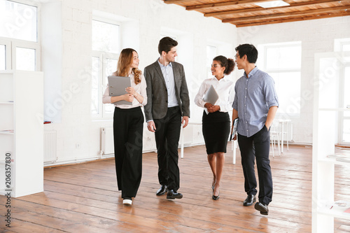 Group of smiling young multiethnic businesspeople © Drobot Dean