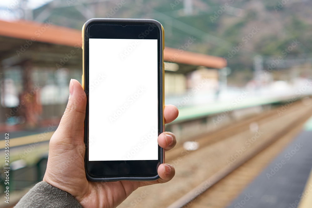 the tourist Use your smartphone to find directions, directions, location reviews. Today's smartphones can be very useful. The concept of travel, communication technology, the screen is white. the tourist Use your smartphone to find directions, directions, location reviews. Today's smartphones can be very useful. The concept of travel, communication technology, the screen is white.