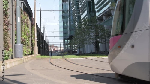 Birmingham, UK, May 17 2018: A tram drives towards Snow Hill Station on a sunny day.