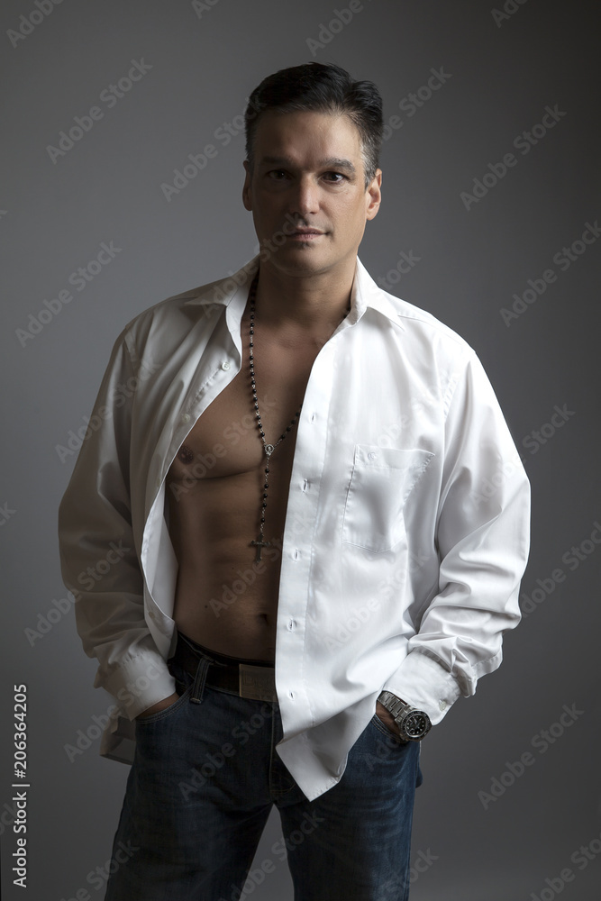 Handsome man in a white shirt posing Handsome man in a white shirt posing