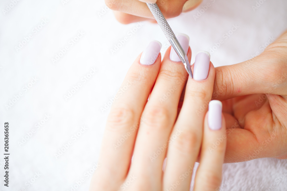 Beauty and Care. Beautiful Women's Hands with Perfect Manicure. A Woman In The Beauty Salon Performs Procedures. Spa Manicure. Beauty and Care. Beautiful Women's Hands with Perfect Manicure. A Woman In The Beauty Salon Performs Procedures. Spa Manicure.