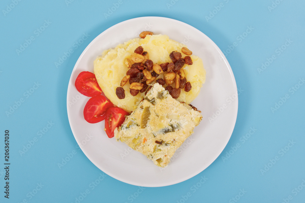 Baked leek with mashed potatoes on a blue Baked leek with mashed potatoes on a blue
