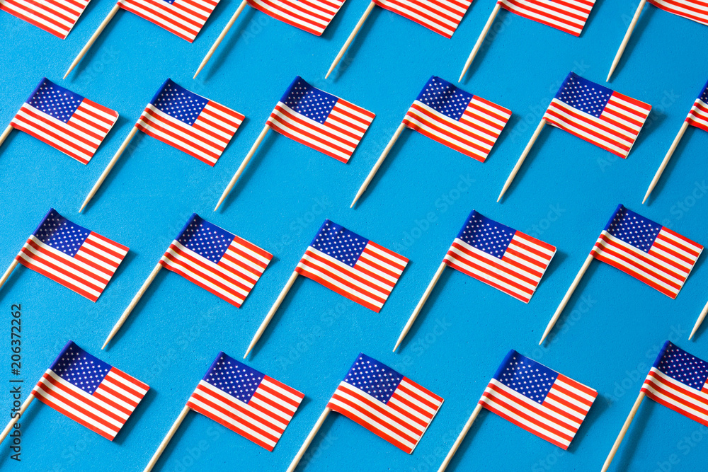 USA flags pattern on blue background USA flags pattern on blue background