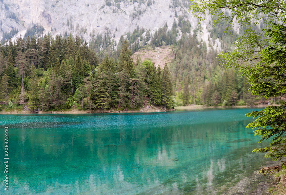 Turquoise colored lake in the heart of Austria