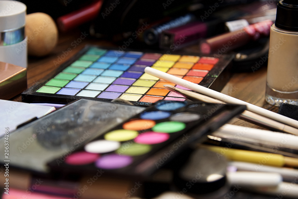 A set of various shadows, brushes and cosmetics for makeup close-up. A set of various shadows, brushes and cosmetics for makeup close-up.