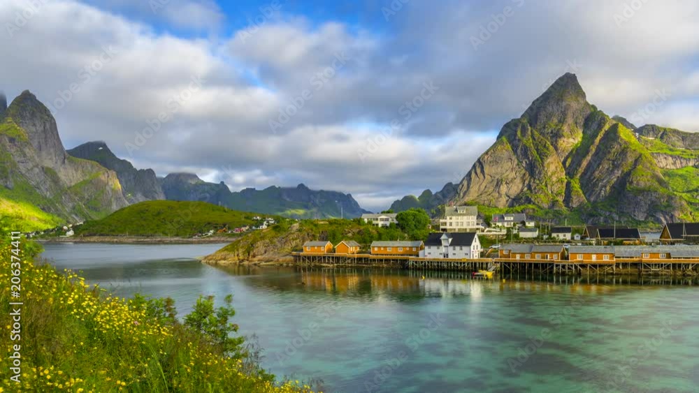 4k timelaspe Moving clouds over traditional Norwegian fisherman's cabins, rorbuer, on the island of Hamnoy, Reine, Lofoten islands, Summer of Norway. 4k timelaspe Moving clouds over traditional Norwegian fisherman's cabins, rorbuer, on the island of Hamnoy, Reine, Lofoten islands, Summer of Norway.