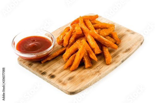 Sweet potato fries and ketchup sauce isolated on white background