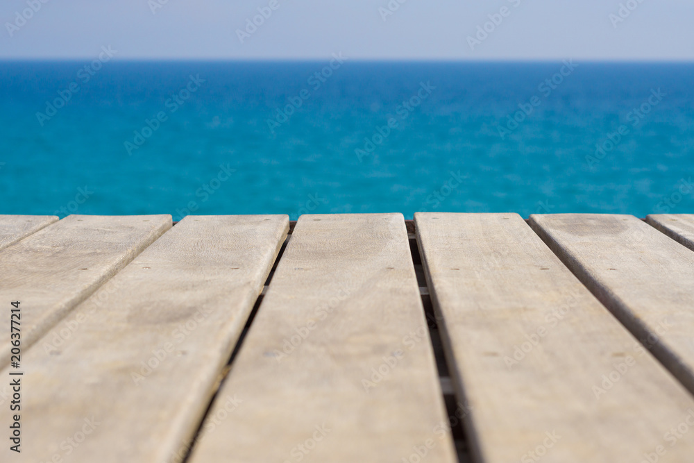Wooden deck with the sea in the background