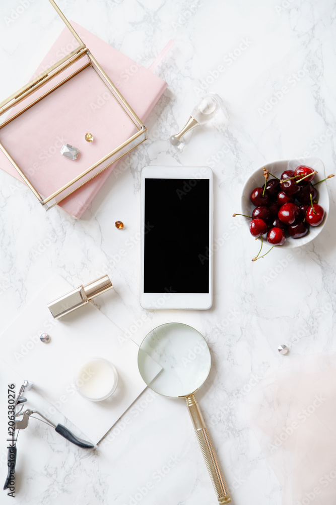 Flatlay mock up with mobile phone screen and feminine accessories on marble background Flatlay mock up with mobile phone screen and feminine accessories on marble background
