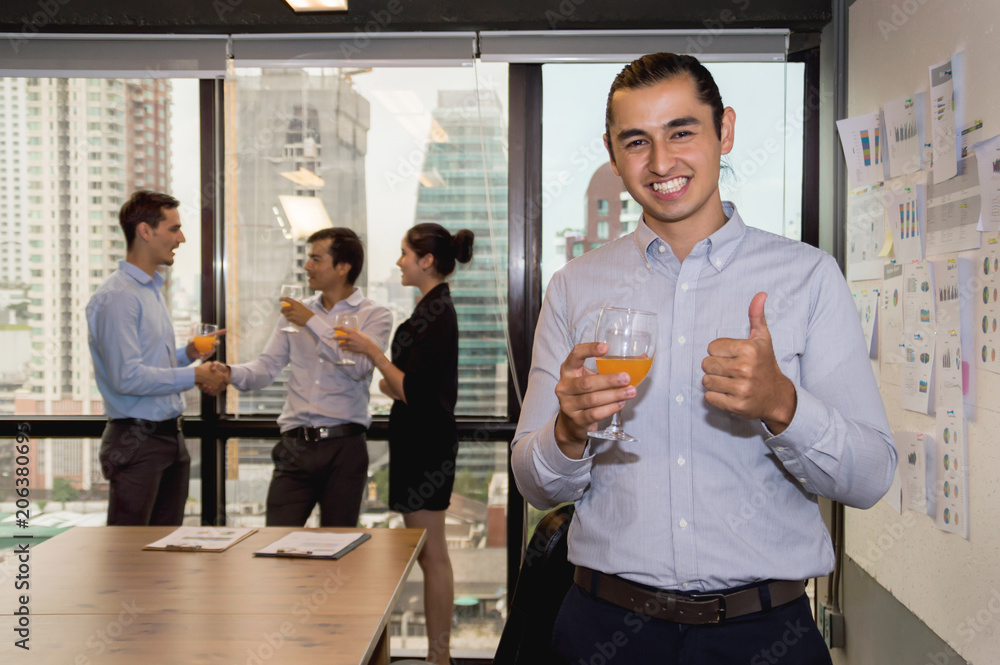 Youngs business people are celebrating success in office. Youngs business people are celebrating success in office.