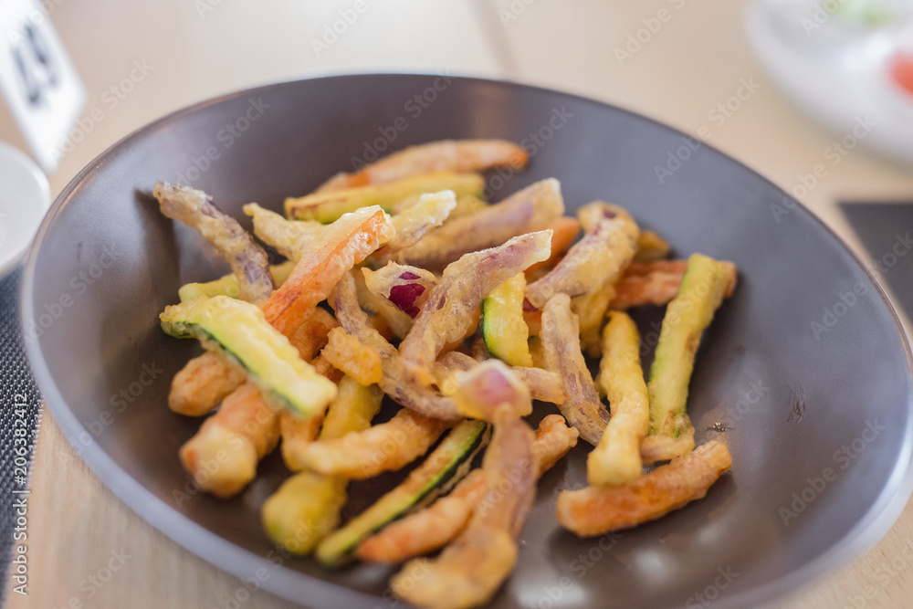 closeup of plate with various fried vegetables closeup of plate with various fried vegetables