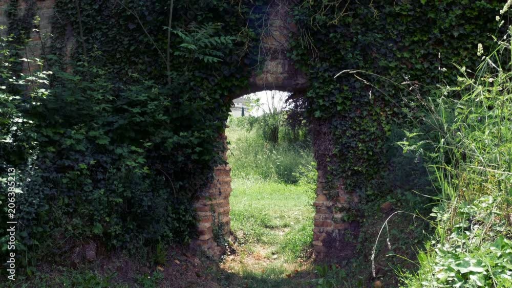 stone wall with arch to bring out the injured horses in Roman times at the Circus of Maxentius, ancient Appia stone wall with arch to bring out the injured horses in Roman times at the Circus of Maxentius, ancient Appia