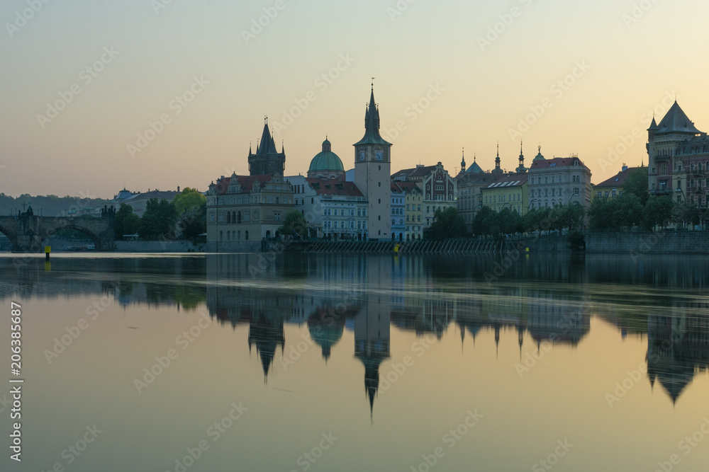 view of Prague by the river, dawn on the Charles bridge next to the castle