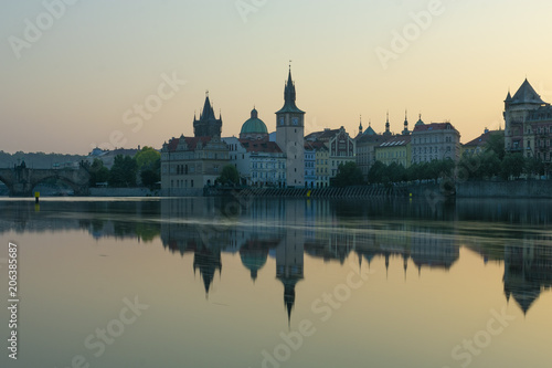 view of Prague by the river, dawn on the Charles bridge next to the castle