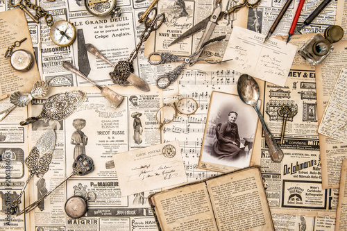 Fototapeta Naklejka Na Ścianę i Meble -  Antique collectible goods books cutlery postcards news paper