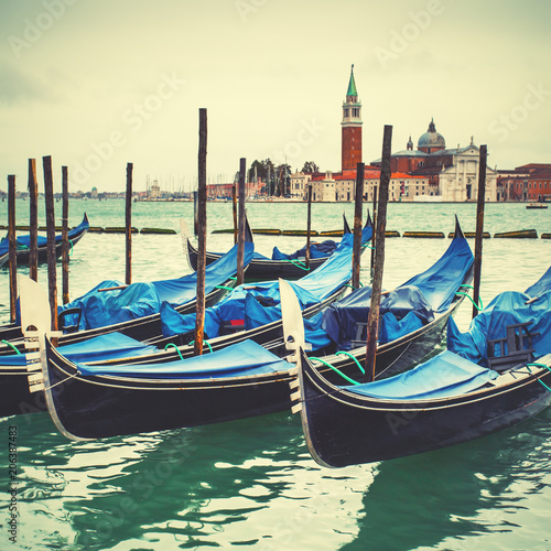 Venetian lagoon with moored gondolas